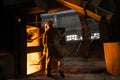 Steelworker at work near the working arc furnace Royalty Free Stock Photo