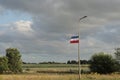 Farmer protest: upside down Dutch flag hanging on lamp post