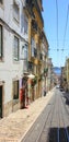 Steep alley with the reails of the bica elevator in lisbon