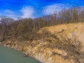 The steep clay slope of the riverbank