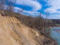 The steep clay slope of the riverbank