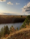 Steep cliff of pine forest overlooking the river.