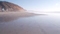 Steep cliff, rock or bluff, California coast. People walking, Torrey Pines beach Royalty Free Stock Photo