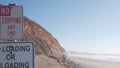 Steep cliff, rock or bluff, California coast. People walking, Torrey Pines beach Royalty Free Stock Photo