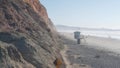 Steep cliff, rock or bluff, California coast. People walking, Torrey Pines beach Royalty Free Stock Photo