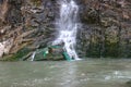 a steep cliff and a waterfall at the Waterfall Bay Park in Hong Kong, China