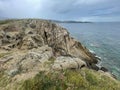 Steep cliffs that descend directly into the sea in Sarti resort, Greece