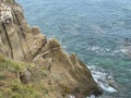 Steep cliffs that descend directly into the sea in Sarti resort, Greece