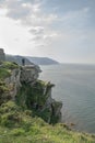 Steep cliffs with distant figure near the Valley of the Rocks ar