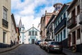 Steep cobblestone street and Sanctuary of Our Lady of Conception in the historic center of Angra do Heroismo