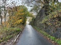 A steep county lane, with a dry stone wall near, Godley Branch Road, Halifax, UK Royalty Free Stock Photo