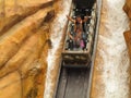 Log flume ride steep drop in cliff family fun motion blur
