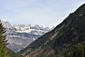 Steep forest mountain and panorama of Alps from tourist path towards to Murg lakes in the Glarus Alps