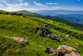 Steep grassy meadow on hillside in mountains Royalty Free Stock Photo