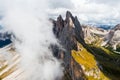 Steep grassy slopes and bare peak of Seceda ridgeline Royalty Free Stock Photo