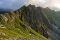 Steep hike path to Krzyzne Pass in Tatra Mountains at summer day. Beautiful view on Orla Perc peaks Royalty Free Stock Photo