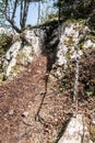 Steep hiking trail with limestone rocks secured by chain
