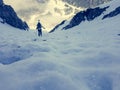 Steep icy slope with blurred alpinist.