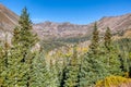 Steep mountain peaks and green pine trees near the summit of Hoosier Pass.