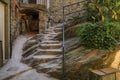 Steep narrow stone stairs on a street in Riomaggiore, Cinque Terre, Italy Royalty Free Stock Photo