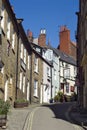 Steep narrow street with houses on either side Royalty Free Stock Photo