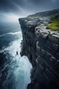 steep ocean cliff. blue sea. stormy sky. waves crashing on the rocks. Sagres