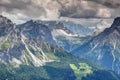 Steep ridges of Sexten Dolomites over forested valleys in Italy