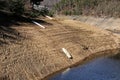 Steep sand banks with abandoned boats on loosed Orlik dam