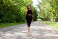 Steep slender Ukrainian woman on the asphalt old road