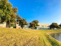 Steep slope hill lawn of lakeside suburban corporate building office park near Dallas, Texas, America