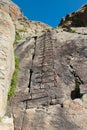 Steep stairs on rock wall