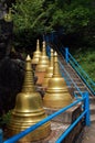 Steep stairs and golden stupas