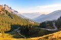 Steep winding road in a majestic mountain landscape in autumn