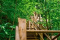 Steep zigzag-shaped wooden stairs up steep hill Royalty Free Stock Photo