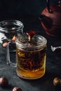 Steeping red tea in glass mug