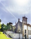 Steeple of the church called Nossa senhora do Carmo with two bells and gardens next to it, in Santa MarÃÂ­a street in the old part