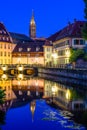 The steeple of Notre-Dame cathedral and the Petite France quarter at nightfall in Strasbourg, France Royalty Free Stock Photo