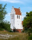 The steeple tower of Falsterbo church standing almost at the beach in the south west tip of Sweden