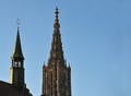 Steeple of Ulm Minster and turret on town hall Royalty Free Stock Photo