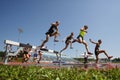 Steeplechase Track Men Jump Water Royalty Free Stock Photo