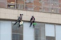 Steeplejacks Work on a Wall in Moscow