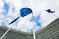 Flags of the European Union against the background of the European Commission building Berlaymont in Brussels, Belgium Royalty Free Stock Photo