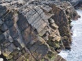 Steeply inclined, fractured rock strata on the Ness of Burgi, south Shetland, UK - Hayes Sandstone Formation - Sedimentary Bedrock