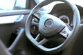 Steering and instrument panel in the car close-up. Left-hand drive. The latest technology and brand cars. Driving