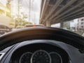 Steering Wheel Against Blurred Speedometer and Traffic Background Royalty Free Stock Photo