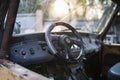 Steering wheel and broken glass of an old car Royalty Free Stock Photo