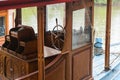 Steering wheel in captain room on the fishing boat.