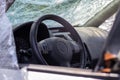 The steering wheel of a car after an accident. The driver`s airbags did not deploy. View from the left side window. Broken