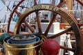 Steering wheel and the compass at the helm of Indonesian Navy tall ship DEWARUCI