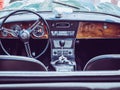 The steering wheel and dashboard of an antique classic car Royalty Free Stock Photo